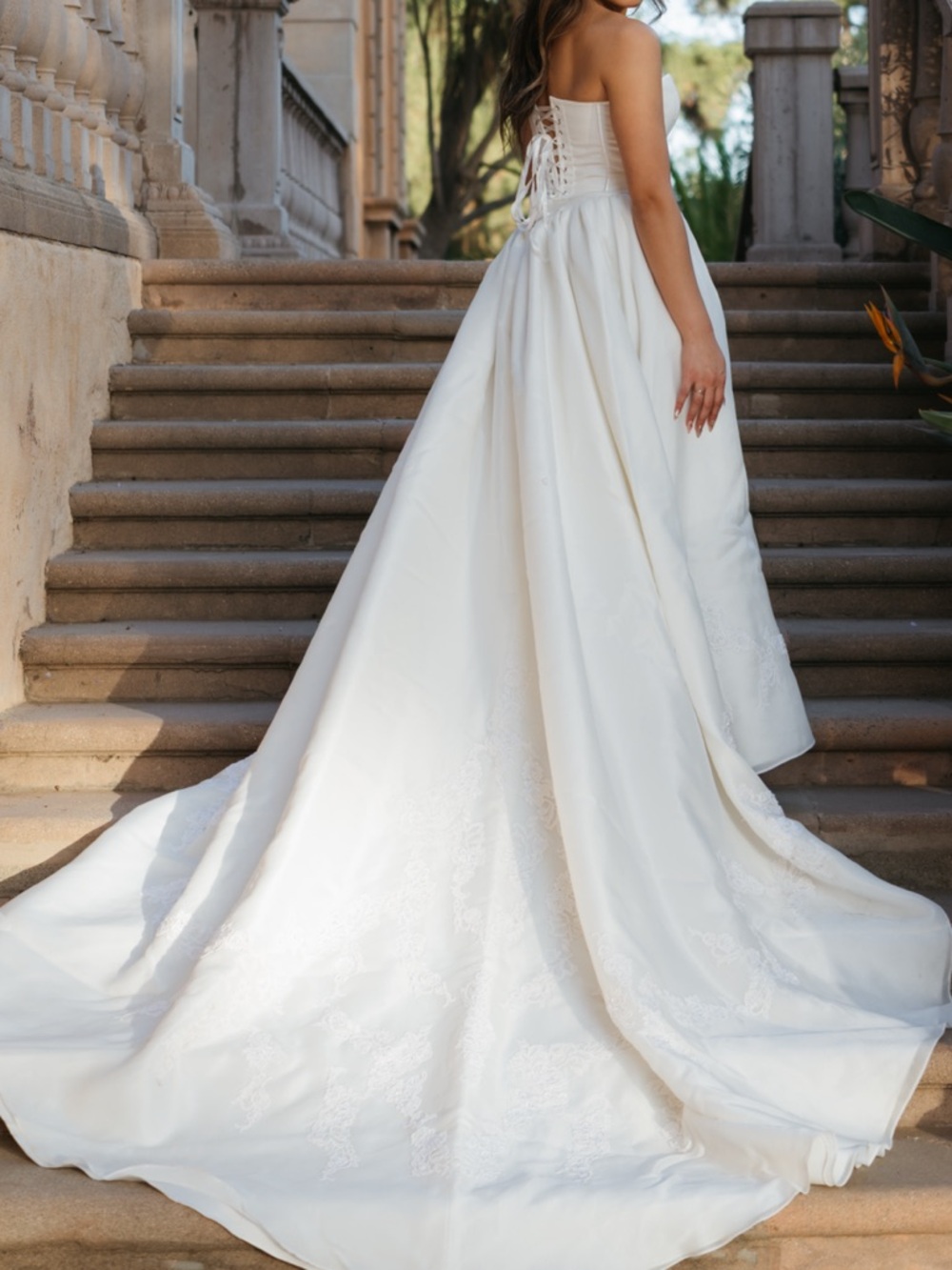 White skirt with a long train with lace detailing